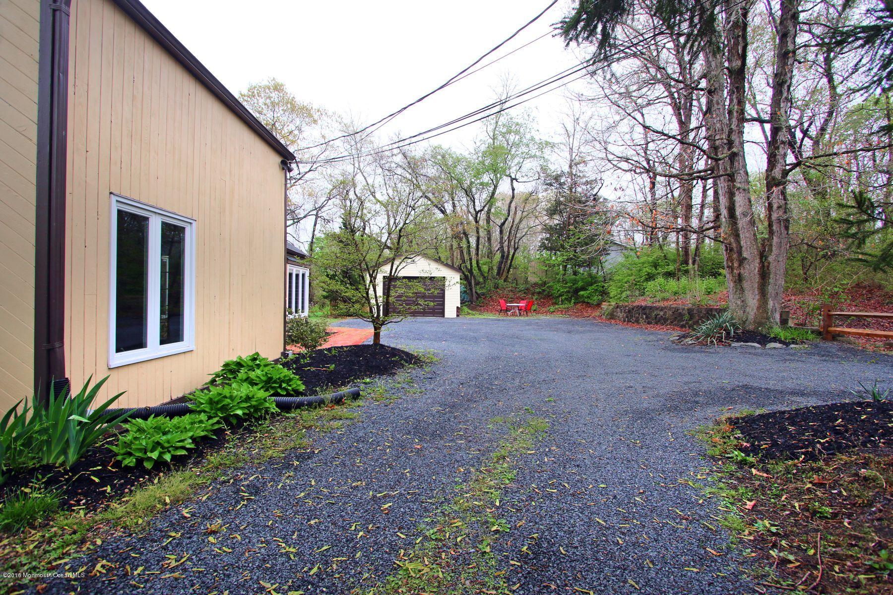 186 Pinebrook Road Tinton Falls, NJ 07724 - Photo 7 of 41 a view of a back yard of the house