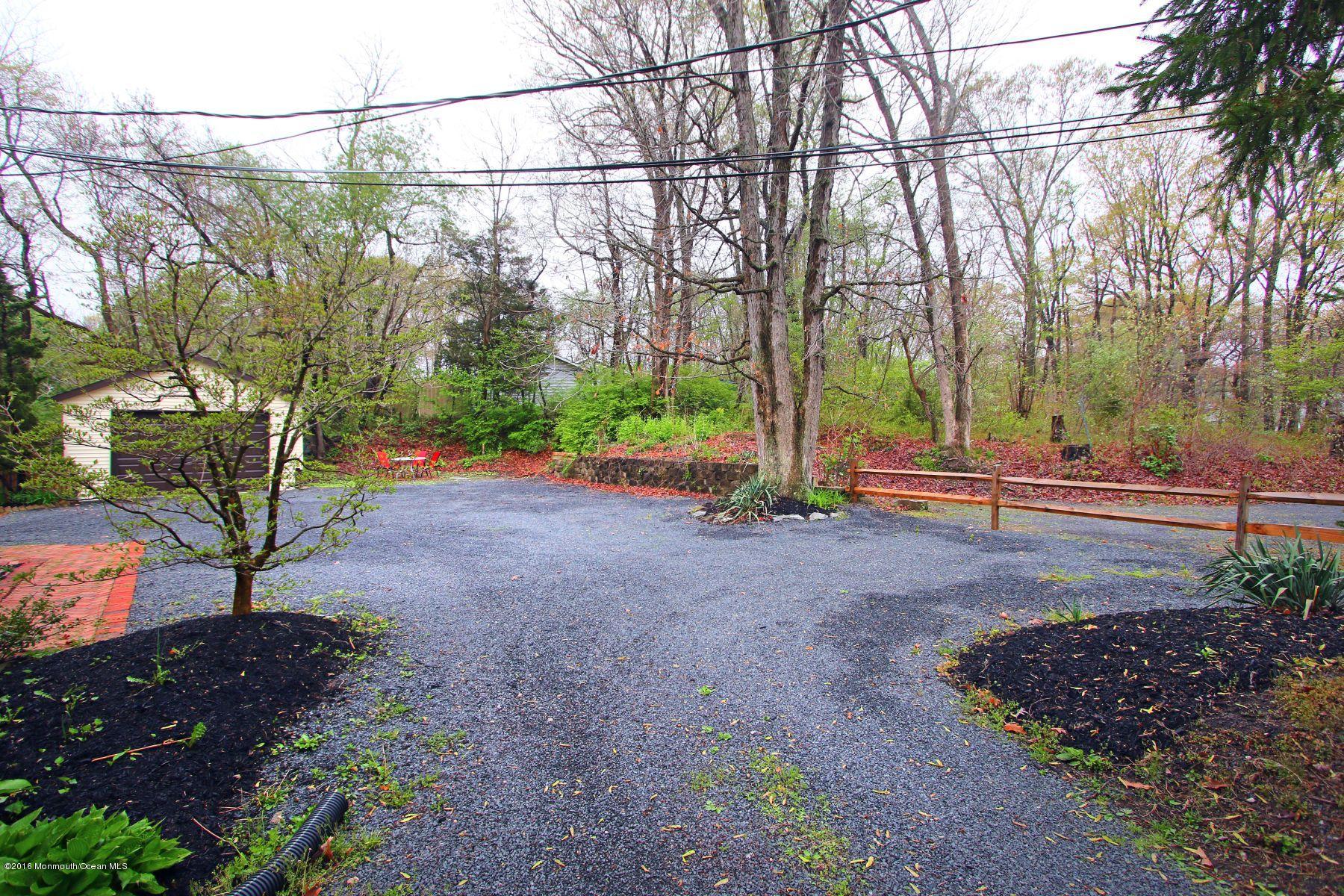 186 Pinebrook Road Tinton Falls, NJ 07724 - Photo 8 of 41 a view of a yard with a tree