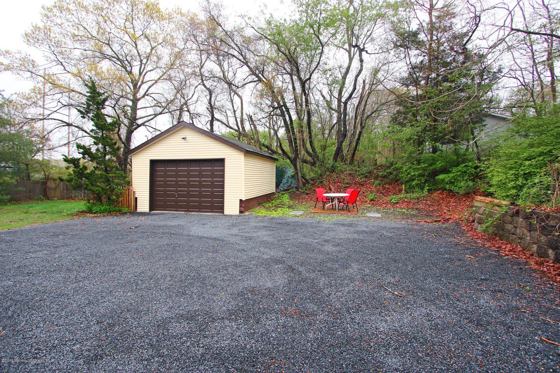 186 Pinebrook Road Tinton Falls, NJ 07724 - Photo 9 of 41 a view of backyard of house with green space