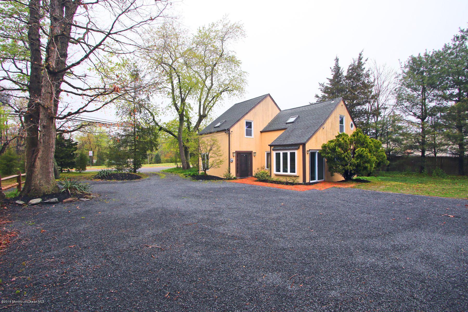 186 Pinebrook Road Tinton Falls, NJ 07724 - Photo 10 of 41 a view of a house with a yard