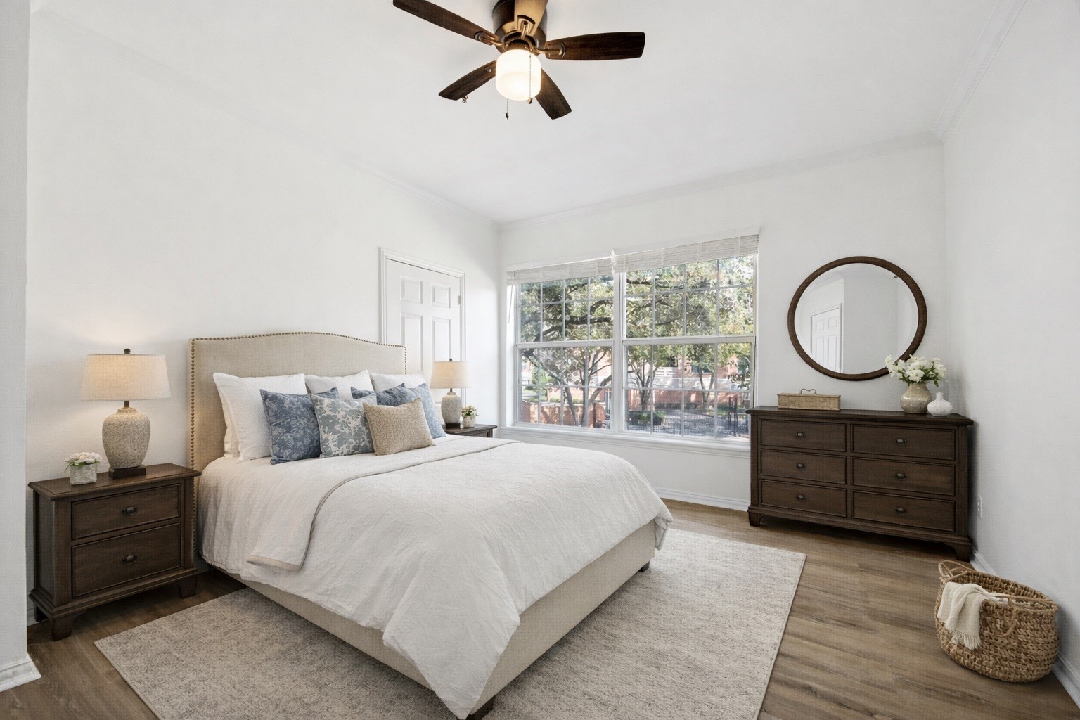 2111 Welch Street, Unit A103 Houston, TX 77019 - Photo 12 of 24 a bedroom with a large bed and a dresser