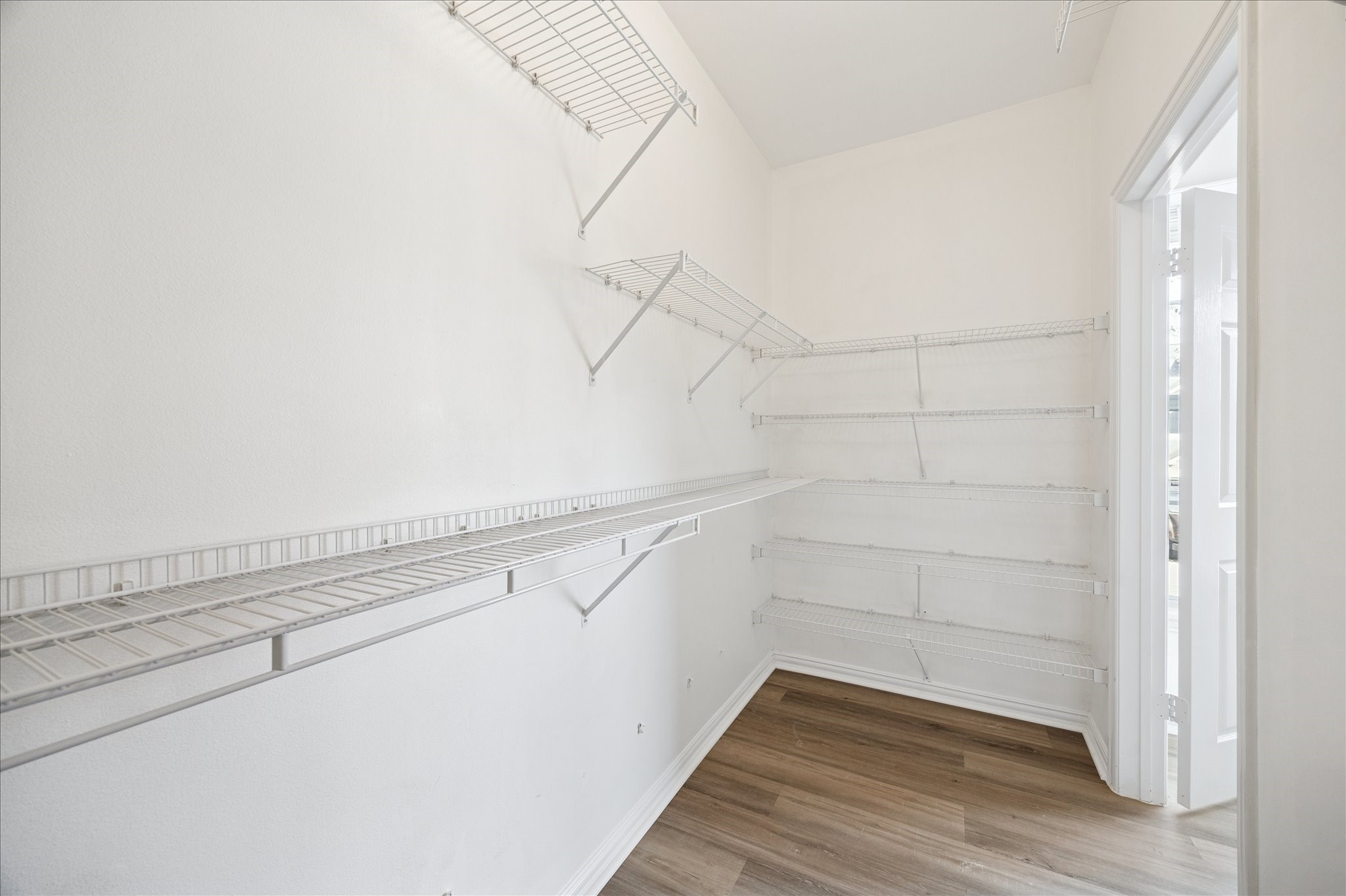 2111 Welch Street, Unit A103 Houston, TX 77019 - Photo 13 of 24 a view of a room with racks on the wall