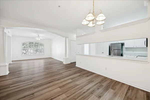 a view of kitchen and wooden floor