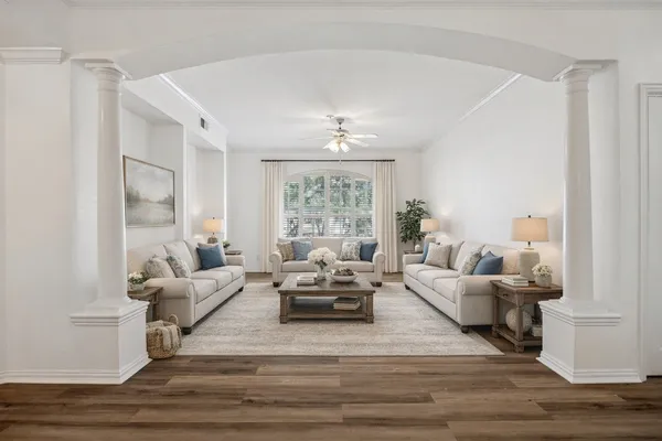 a living room with furniture and a large window