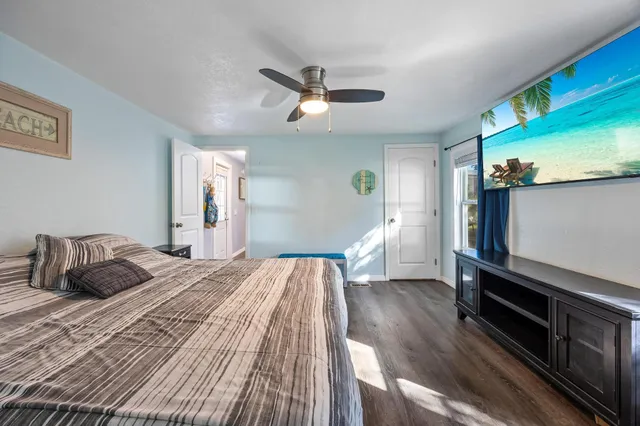 a view of a wooden deck and a yard with swimming pool