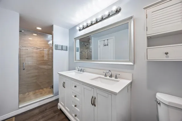 a view of a chair and table in backyard of the house