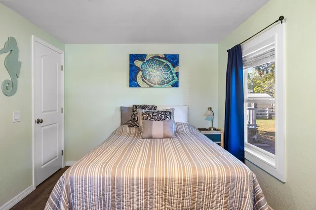 a view of house with backyard and swimming pool