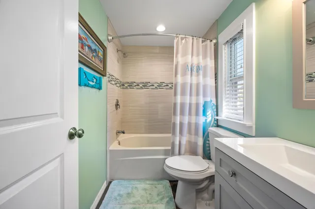 a view of a patio with a table and chairs