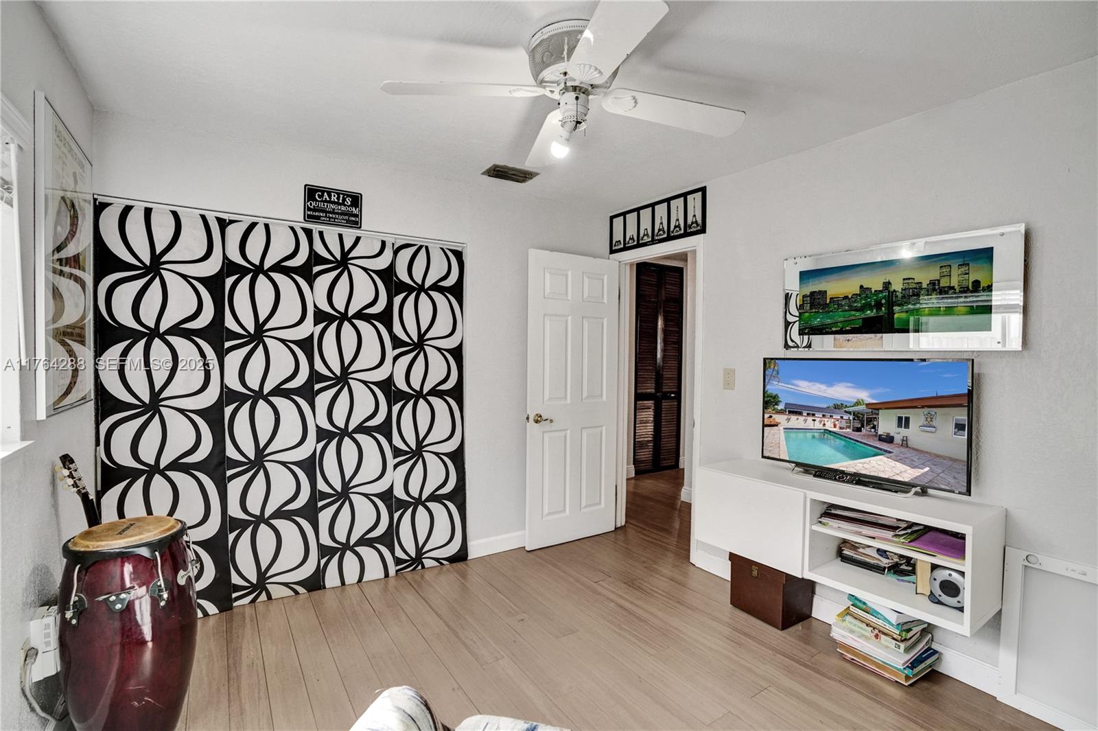 7825 Northwest 174th Street Hialeah, FL 33015 - Photo 16 of 30 a view of an entryway with wooden floor