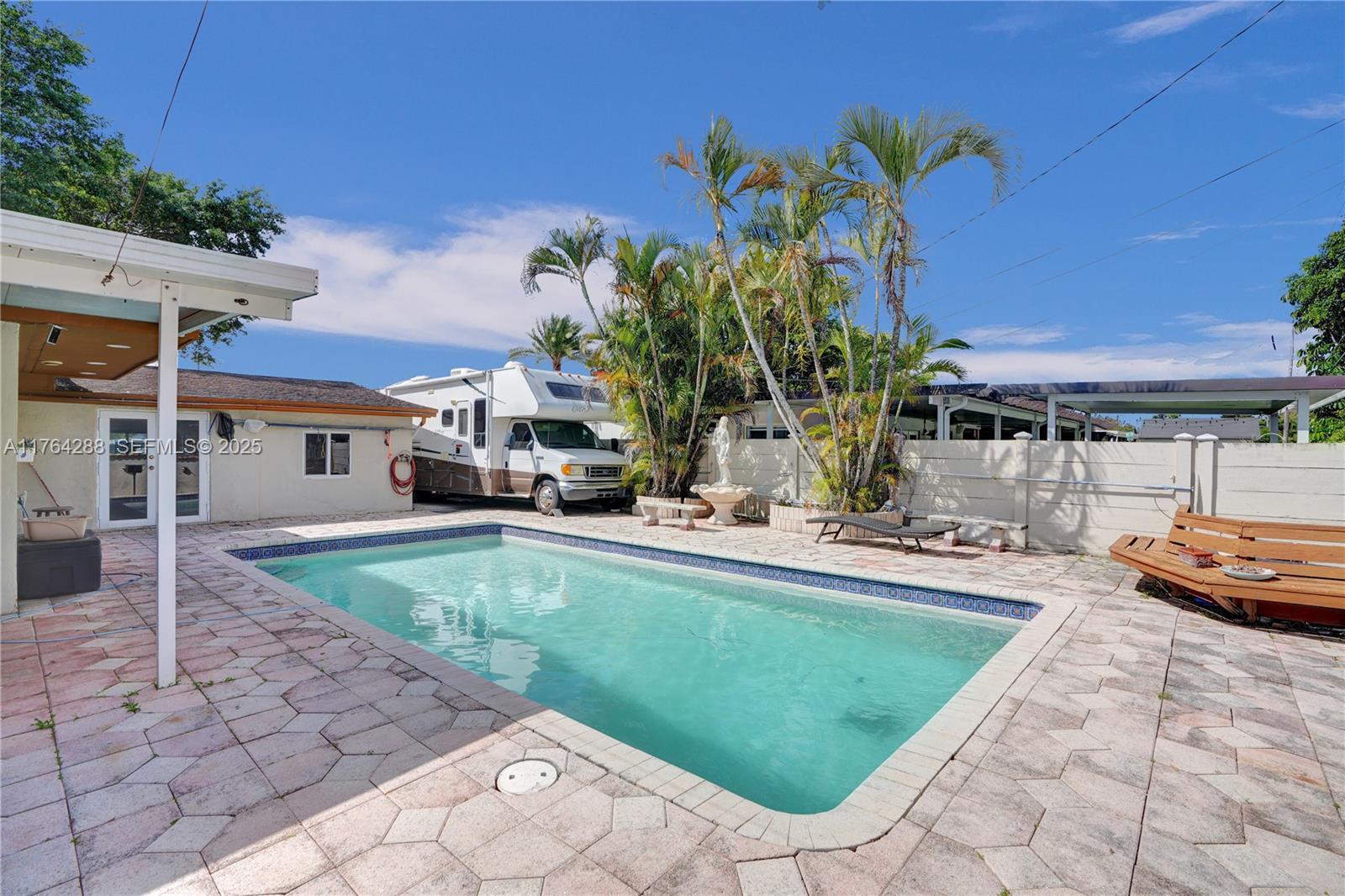 7825 Northwest 174th Street Hialeah, FL 33015 - Photo 21 of 30 a view of a house with backyard and sitting area