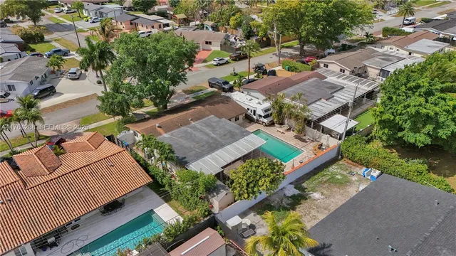 an aerial view of a house with a garden