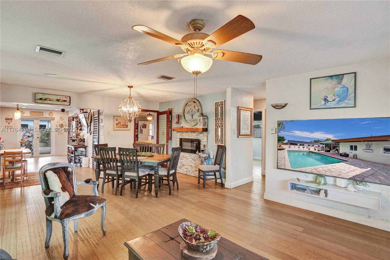 7825 Northwest 174th Street Hialeah, FL 33015 - Photo 3 of 30 a living room with lots of furniture and view of kitchen