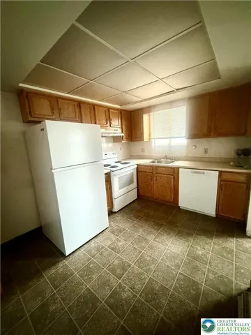 a kitchen with lots of counter top space and appliances
