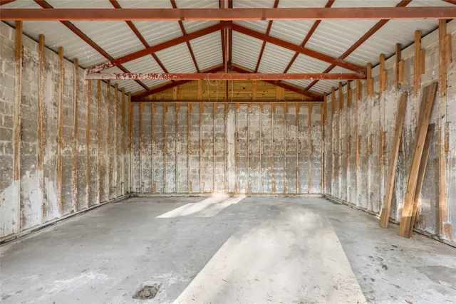 a view of a room with wooden walls