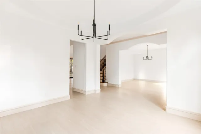 a view of a hallway with a white walls