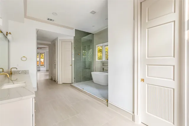 a bathroom with a sink and mirror