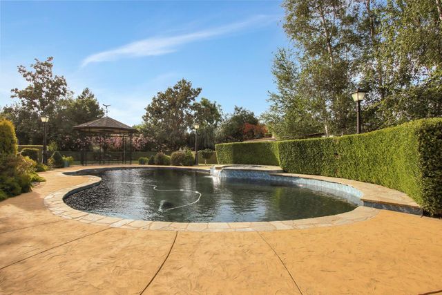 a view of outdoor space with swimming pool