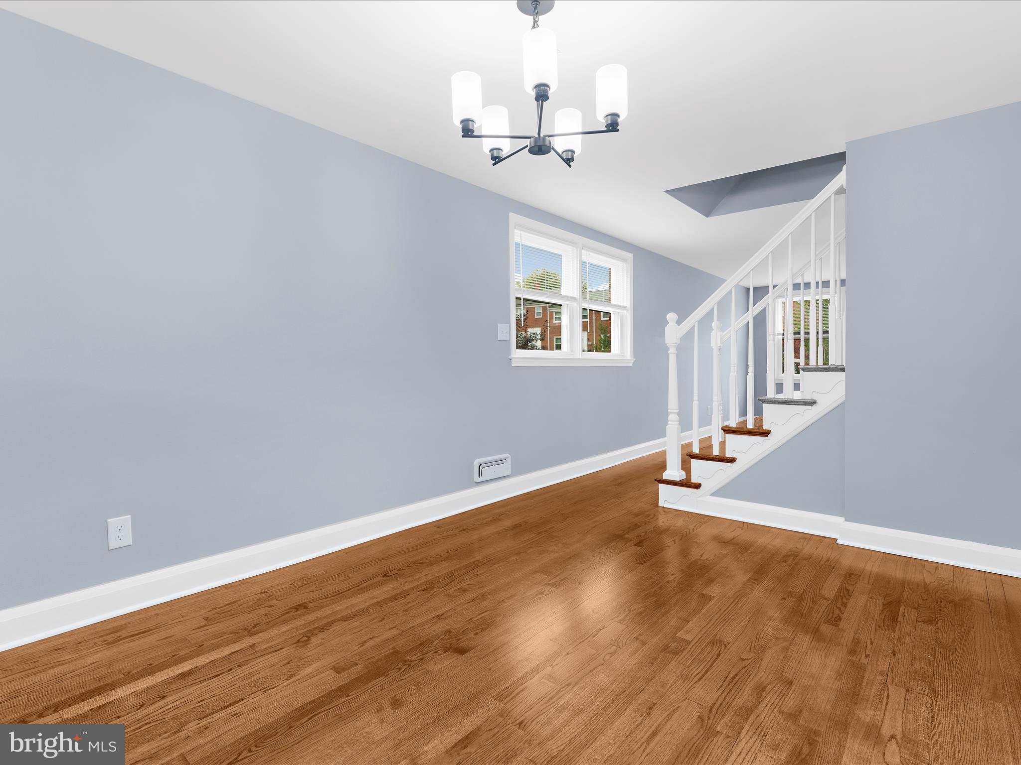 1427 Barrett Road Baltimore, MD 21207 - Photo 12 of 40 wooden floor in an empty room with a window