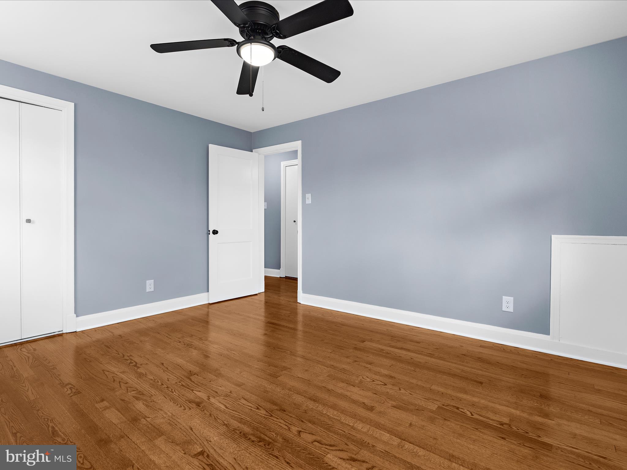 1427 Barrett Road Baltimore, MD 21207 - Photo 18 of 40 a view of an empty room and wooden floor