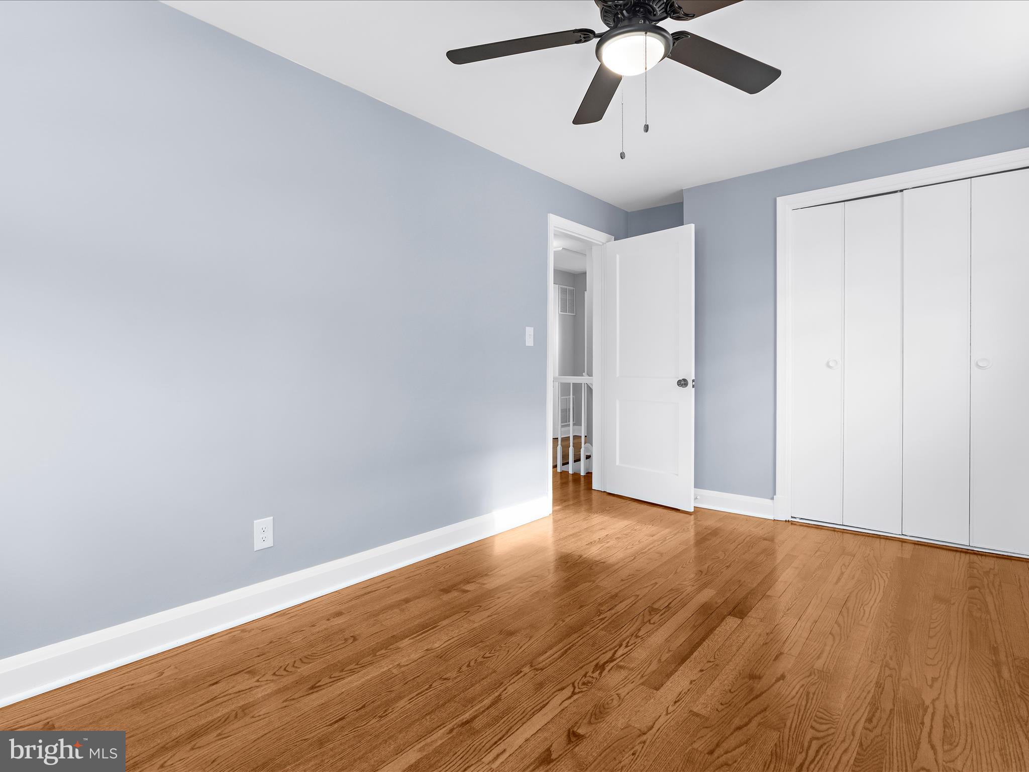 1427 Barrett Road Baltimore, MD 21207 - Photo 22 of 40 a view of an empty room with wooden floor