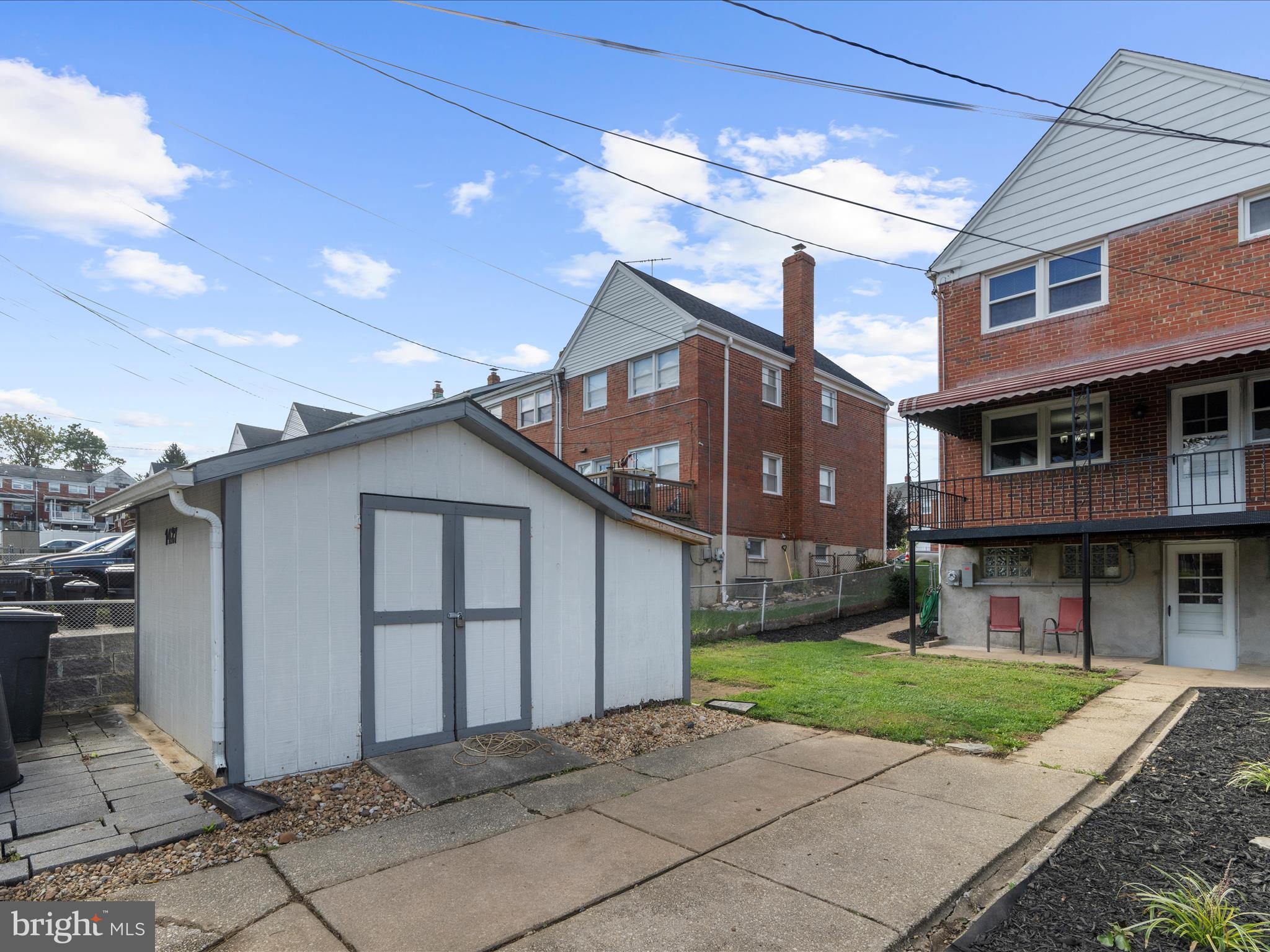 1427 Barrett Road Baltimore, MD 21207 - Photo 32 of 40 a front view of a house with a yard and garage