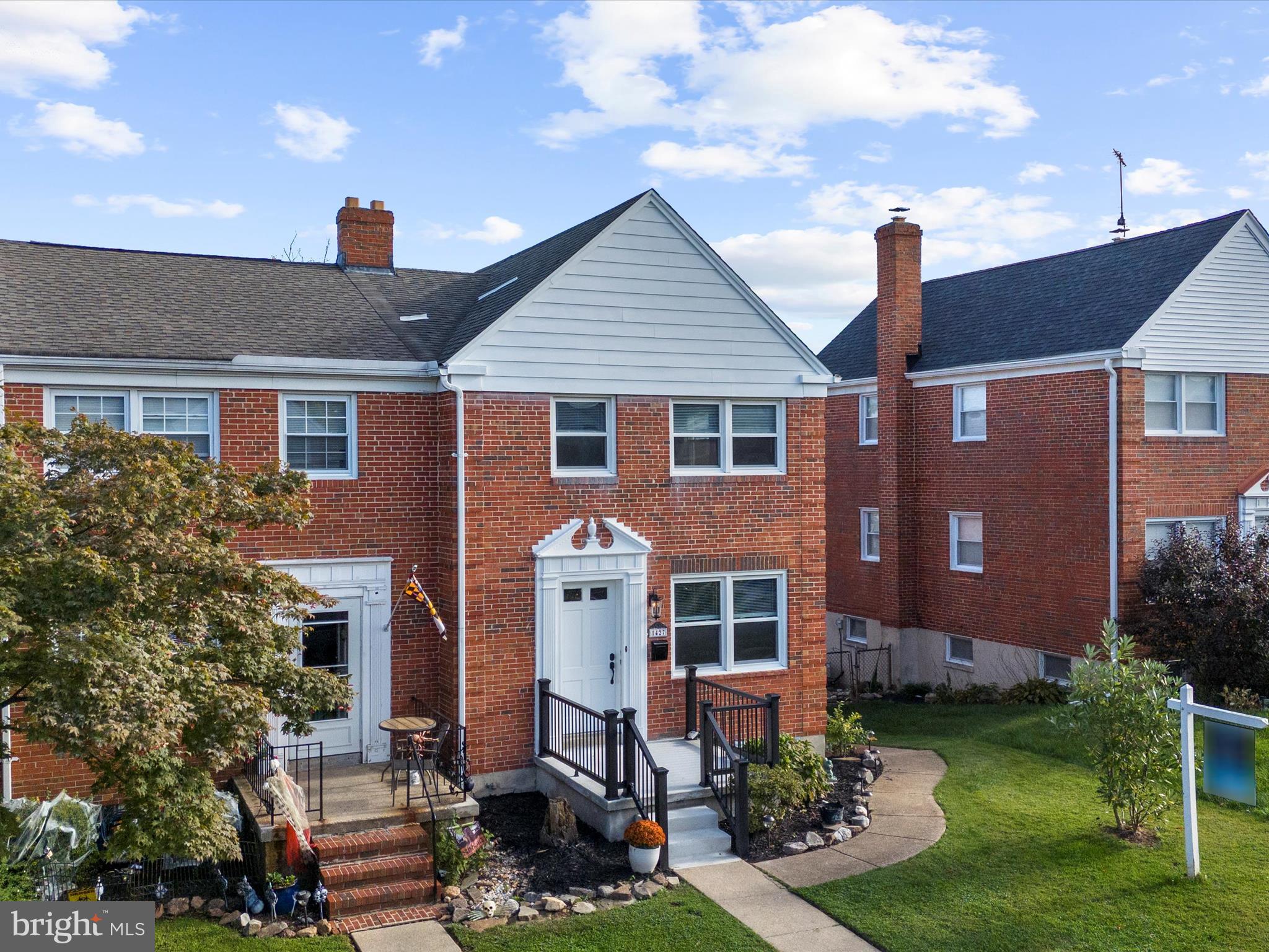 1427 Barrett Road Baltimore, MD 21207 - Photo 5 of 40 a front view of a house with garden