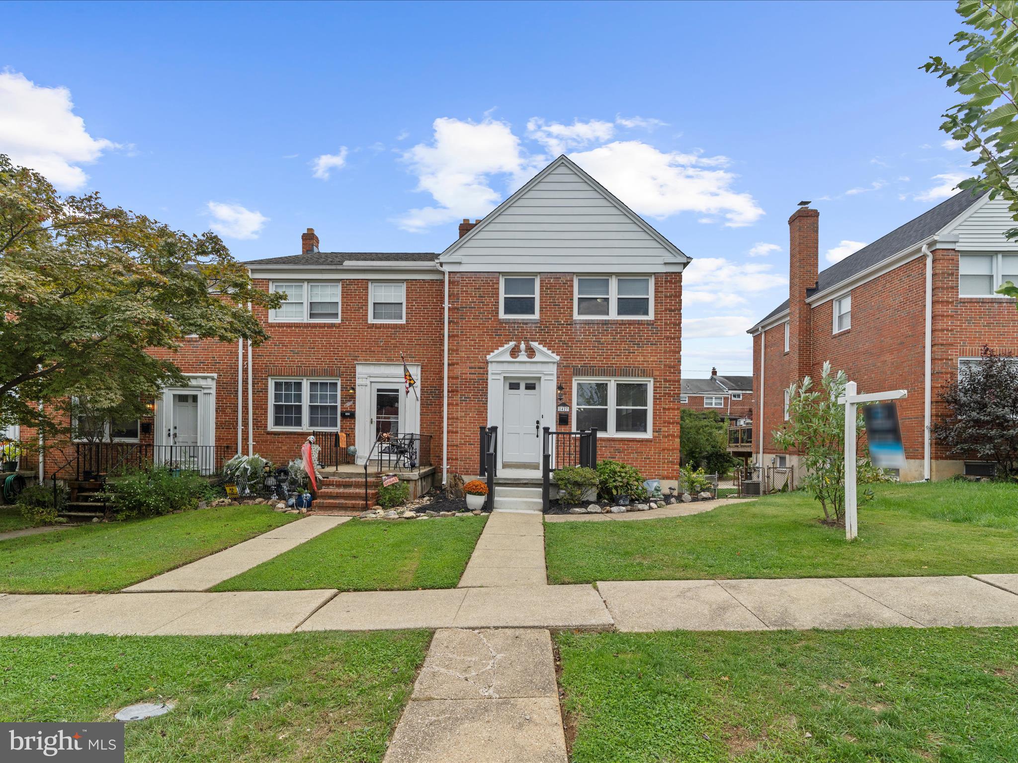 1427 Barrett Road Baltimore, MD 21207 - Photo 6 of 40 a front view of a house with a yard
