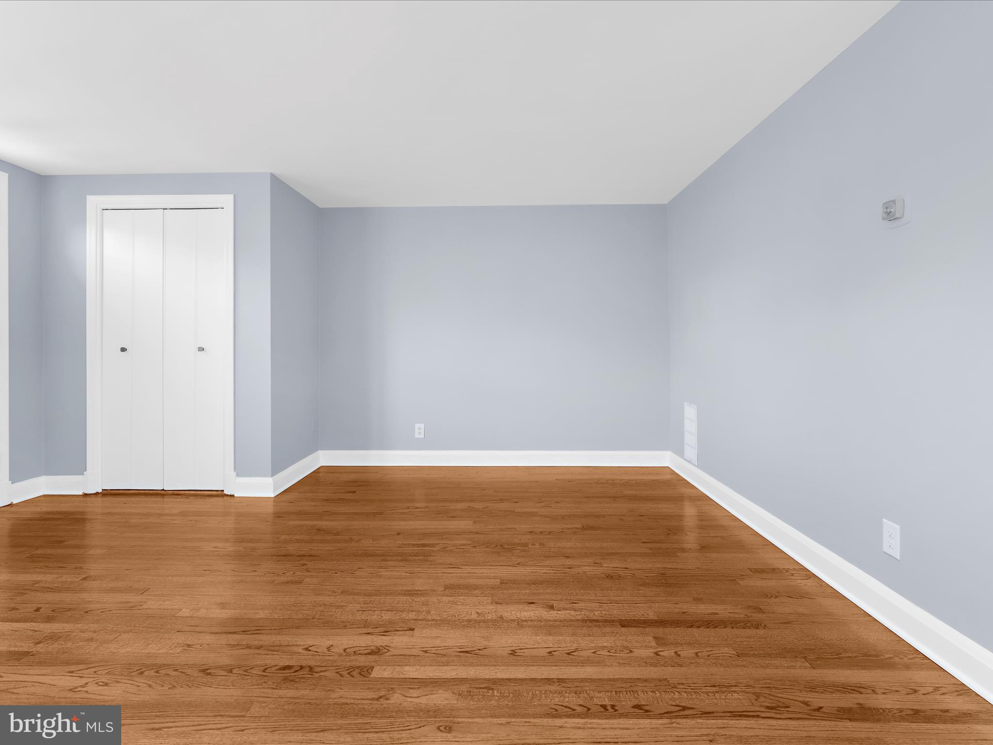1427 Barrett Road Baltimore, MD 21207 - Photo 10 of 40 a view of an empty room with wooden floor and closet
