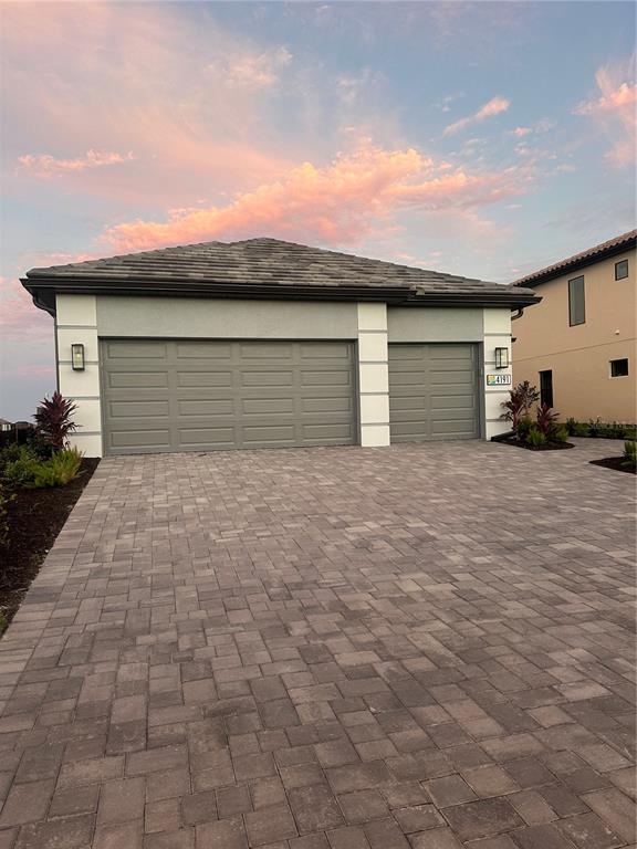 4191 Pegasus Way Naples, FL 34120 - Photo 1 of 1 a front view of a house with a yard