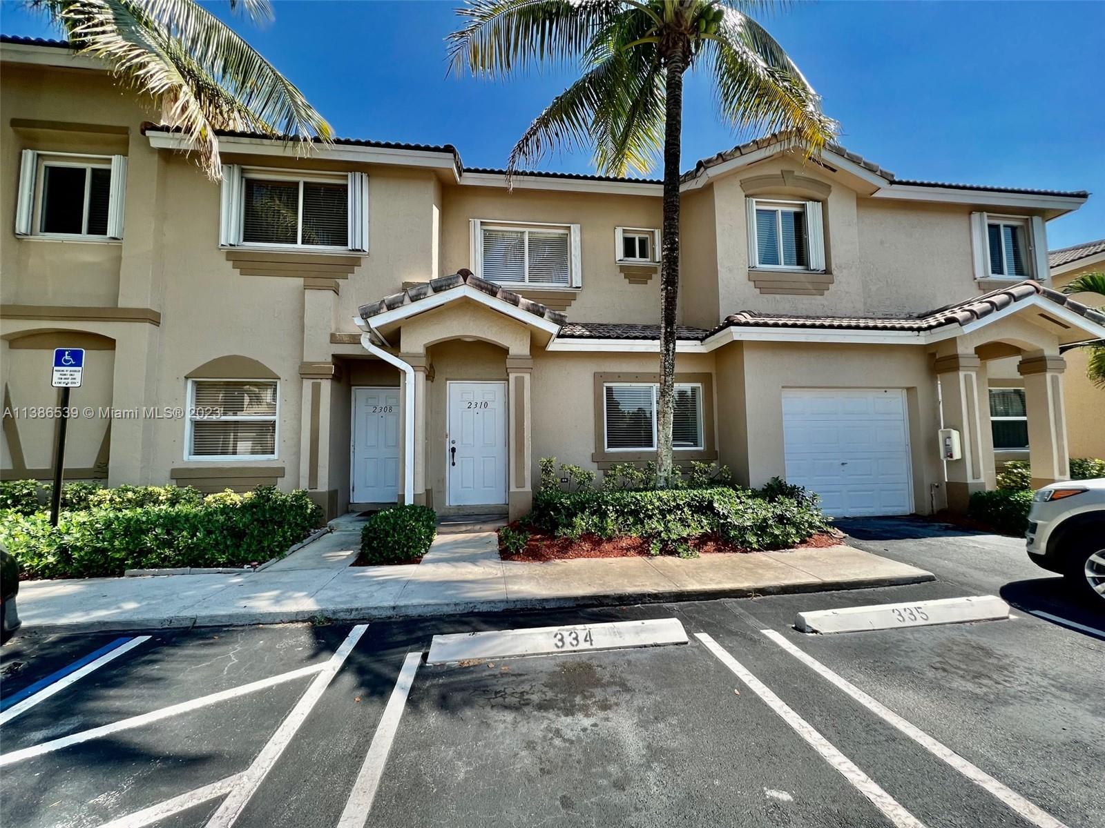 a front view of a house with yard
