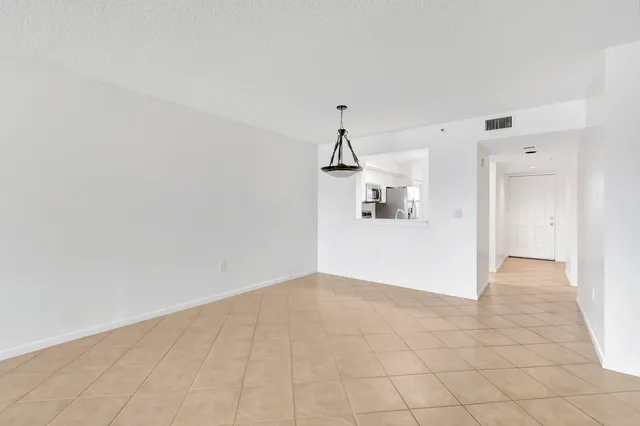 a kitchen with stainless steel appliances a refrigerator sink and microwave