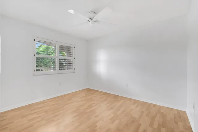 a view of a lake with houses in the back