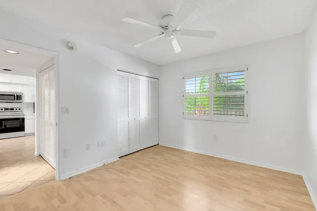 a view of a lake with houses in the back