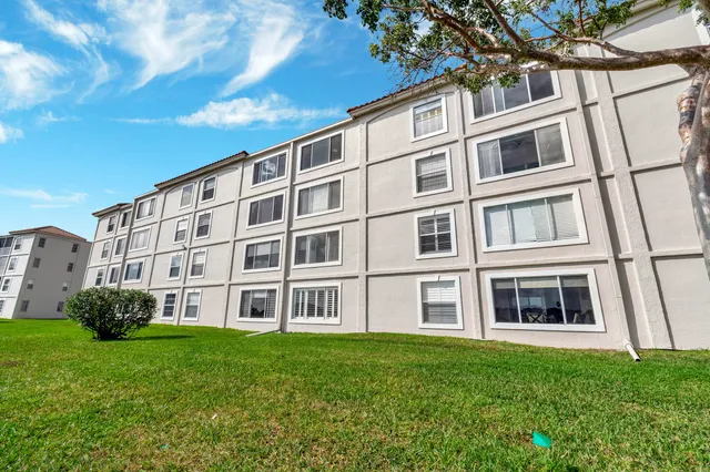 a view of a room with furniture and a potted plant