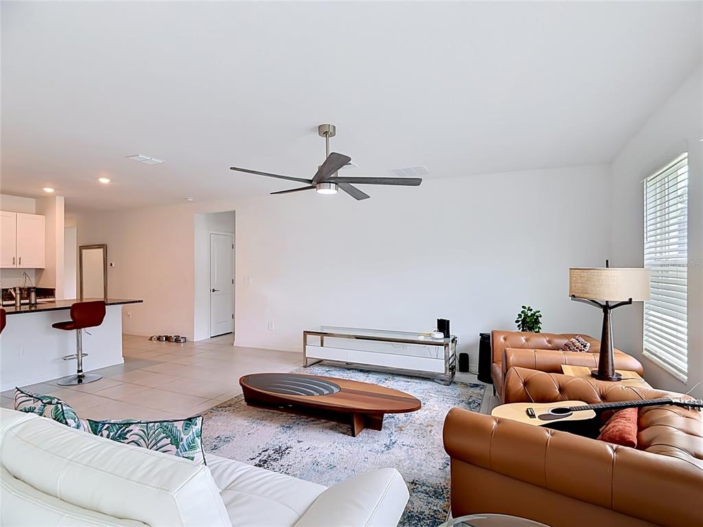 1633 Red Loop Lakeland, FL 33801 - Photo 13 of 60 a living room with furniture and a table