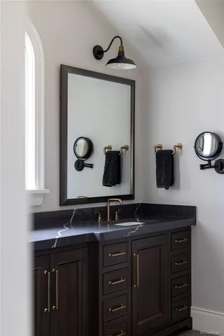 a bathroom with a sink and a mirror