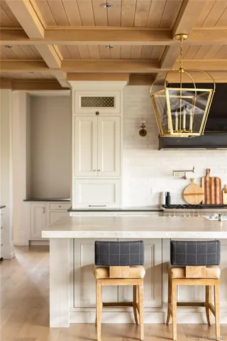 a bathroom with a granite countertop sink and a stove