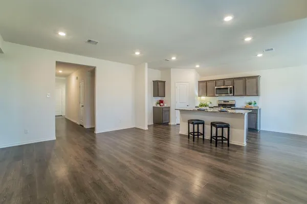 a view of kitchen with table and chairs