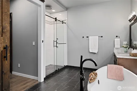 a bathroom with a shower curtain and a window