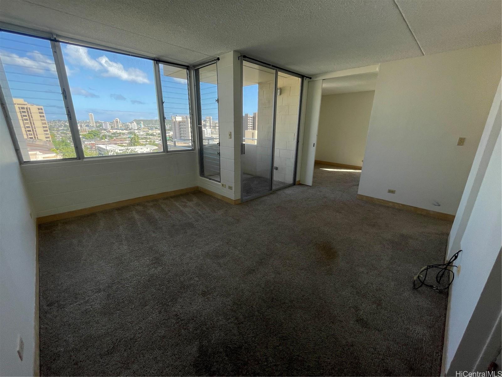 1624 Dole Street, Unit 804 Honolulu, HI 96822 - Photo 2 of 8 a view of an empty room with a window