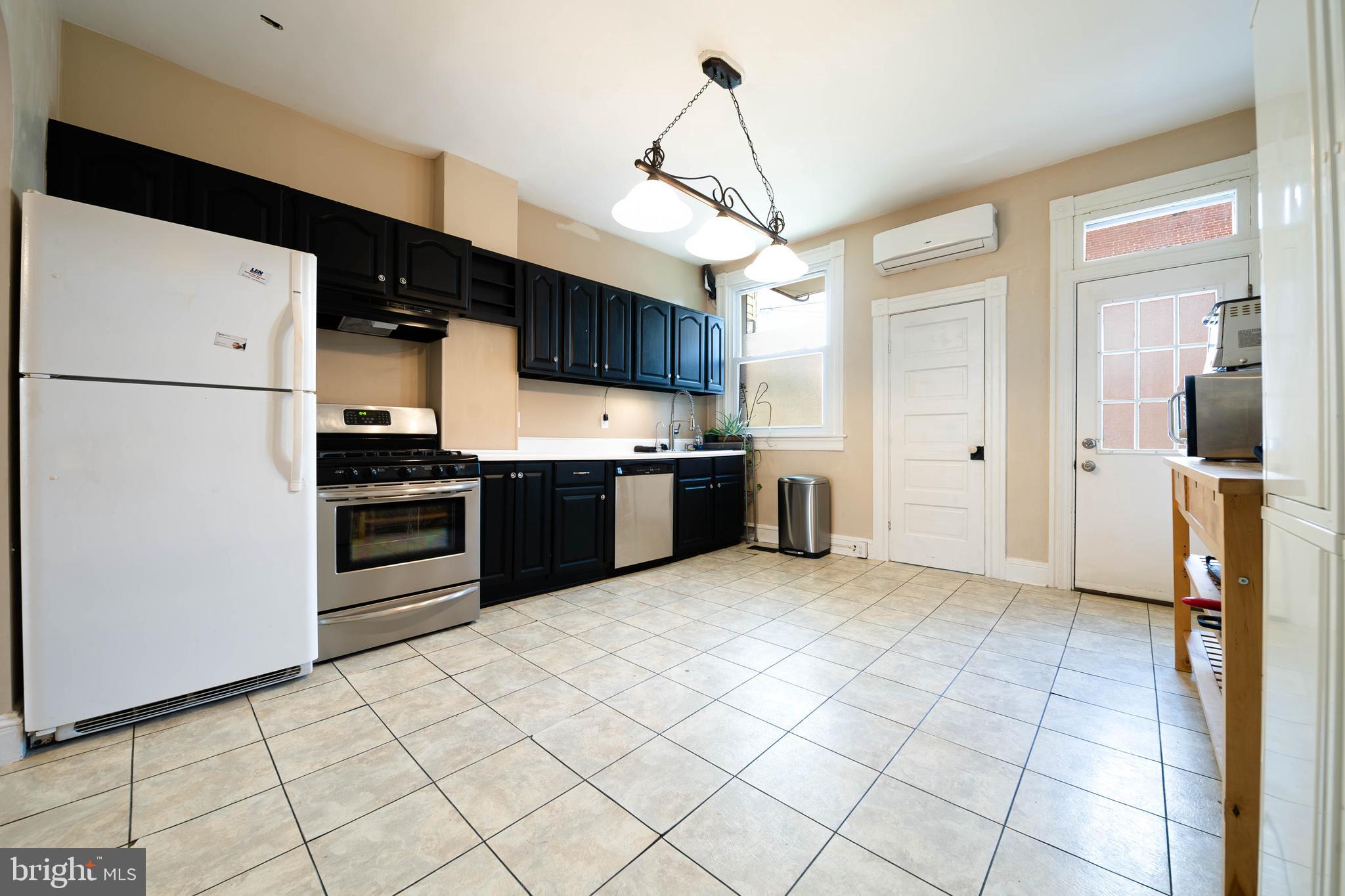 4119 Falls Road Baltimore, MD 21211 - Photo 4 of 14 Kitchen and Half Bathroom