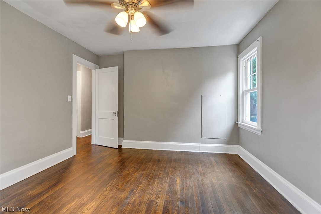 2972 Yorkshire Road Cleveland Heights, OH 44118 - Photo 23 of 44 Interior room featuring wood-finish flooring, light gray walls, white trim, and a window with natural light