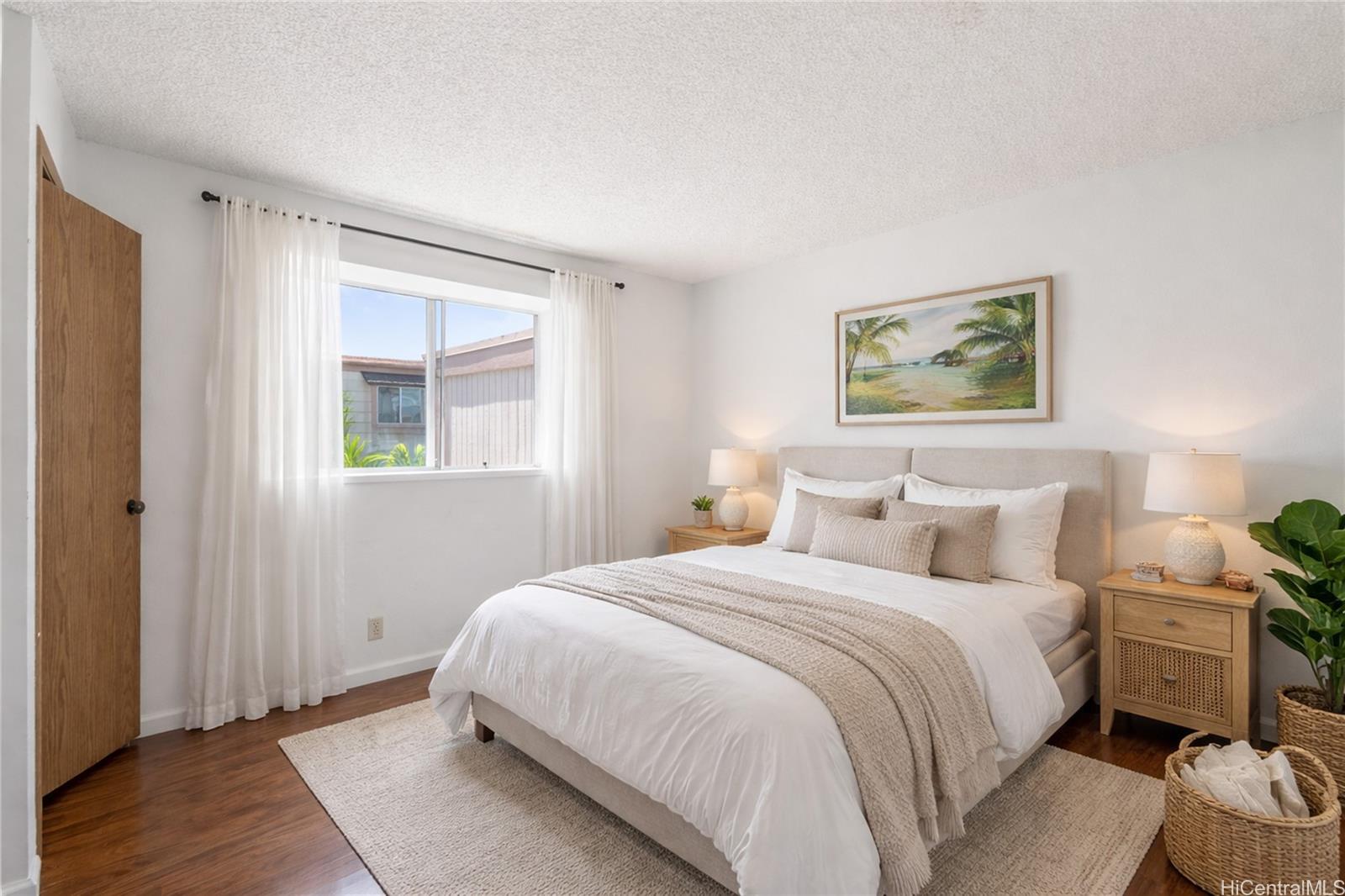 98-941 Moanalua Road, Unit 403 Aiea, HI 96701 - Photo 12 of 19 a bedroom with a bed and a window