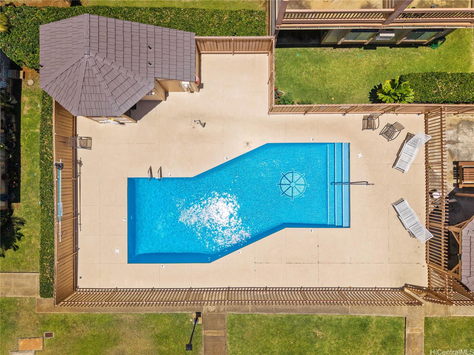 98-941 Moanalua Road, Unit 403 Aiea, HI 96701 - Photo 17 of 19 a view of a house with a swimming pool