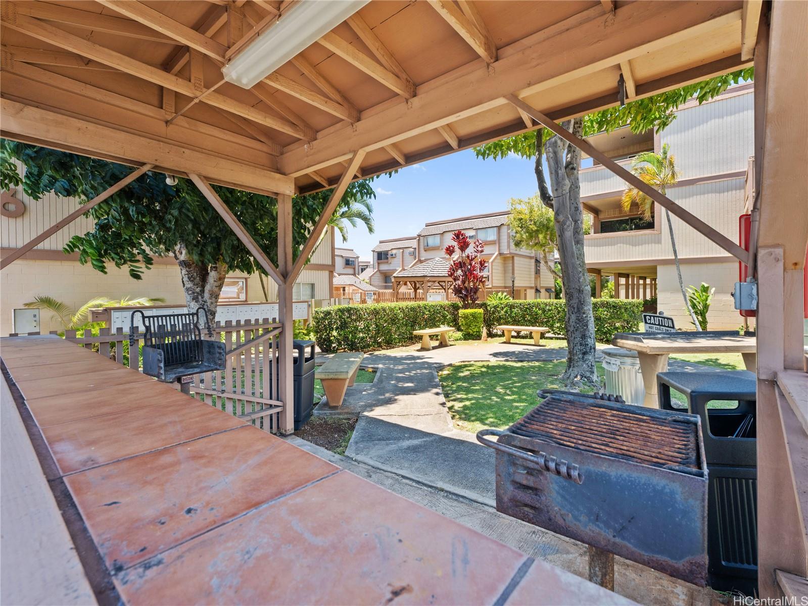 98-941 Moanalua Road, Unit 403 Aiea, HI 96701 - Photo 19 of 19 a view of a porch with furniture and garden