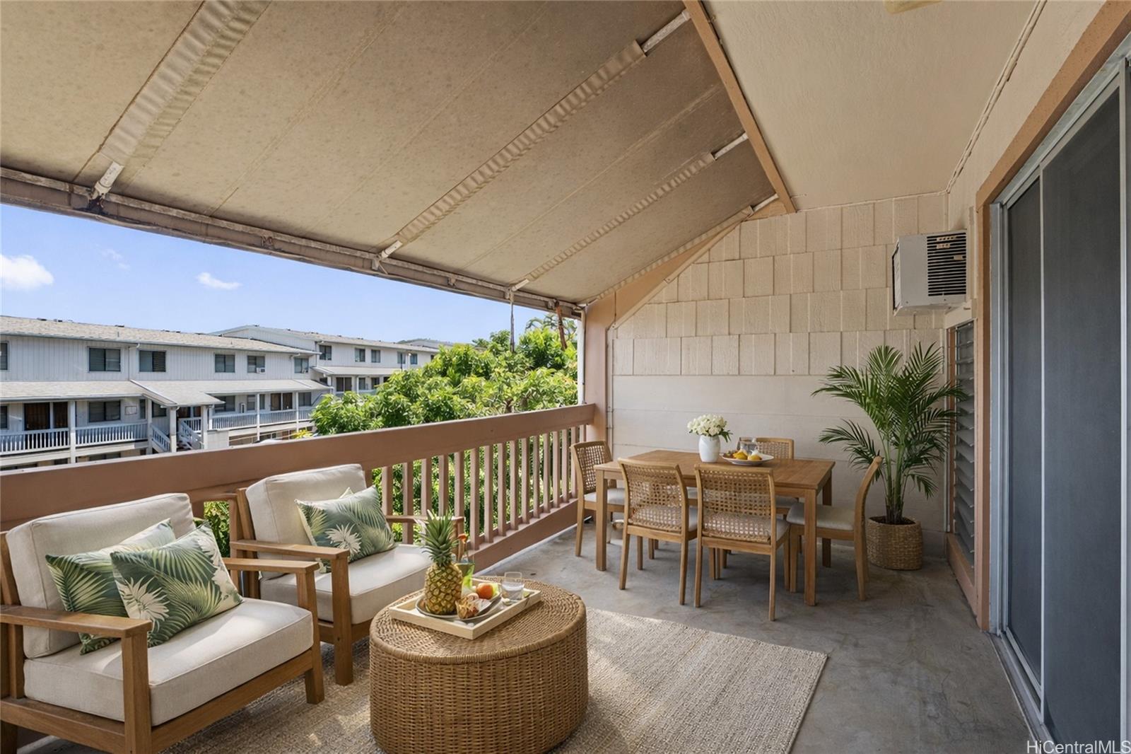 98-941 Moanalua Road, Unit 403 Aiea, HI 96701 - Photo 3 of 19 a balcony with furniture and potted plants