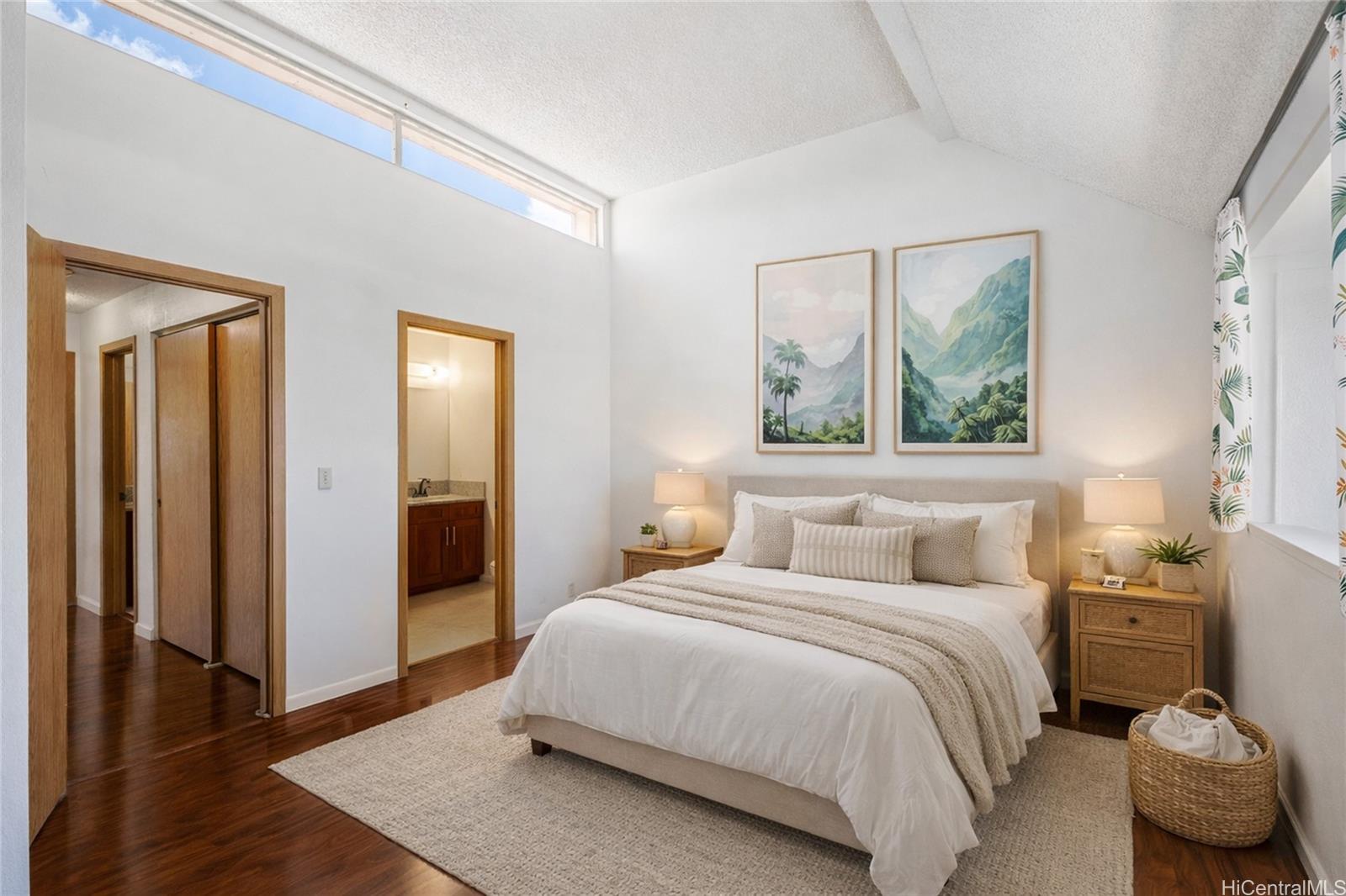 98-941 Moanalua Road, Unit 403 Aiea, HI 96701 - Photo 9 of 19 a bedroom with a bed and a painting on the wall