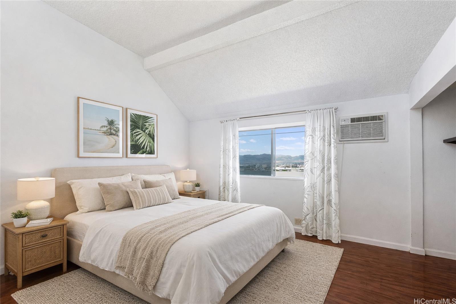 98-941 Moanalua Road, Unit 403 Aiea, HI 96701 - Photo 10 of 19 a bedroom with a bed and a night stand