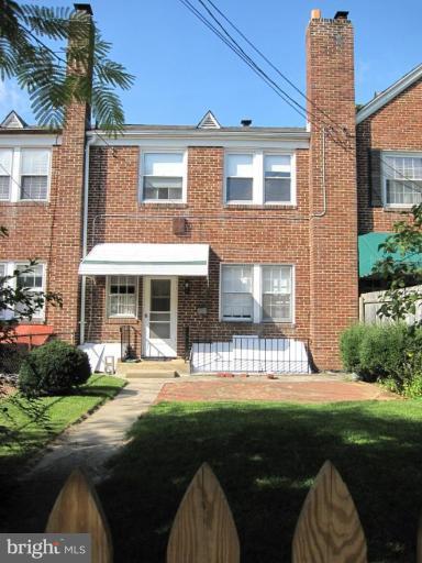 6431 Blenheim Road Baltimore, MD 21212 - Photo 2 of 12 a front view of a house with a yard