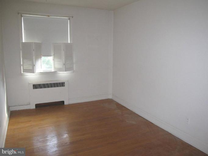 6431 Blenheim Road Baltimore, MD 21212 - Photo 11 of 12 an empty room with a window